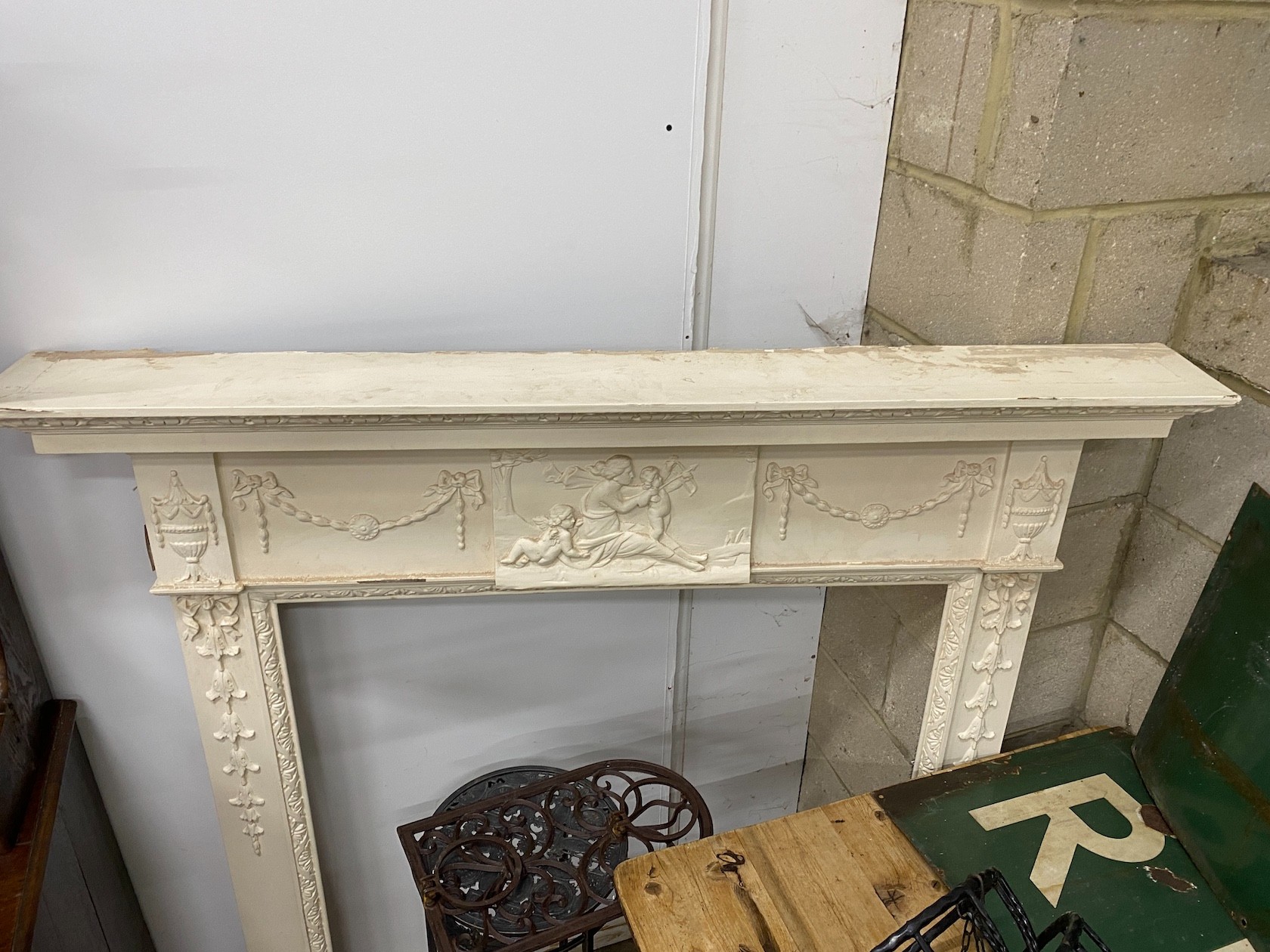 A George III style painted pine and composition fire surround with classical frieze, width 144cm, depth 17cm, height 143cm